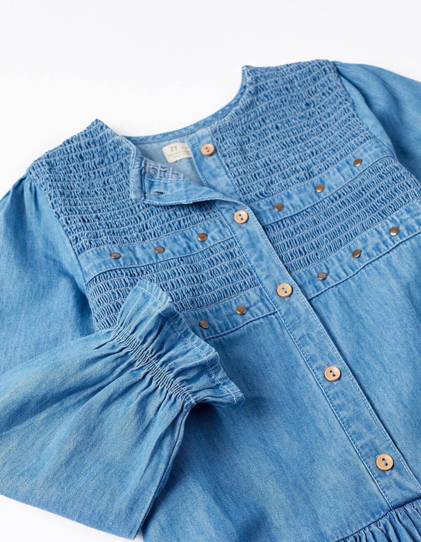 Vestido manga larga con apliques de taches